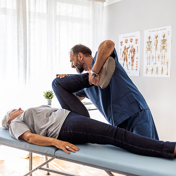 old women chiropractic with doctor in clinic